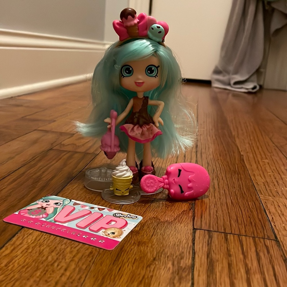 Mint Chocolate Shopkin Doll. Comes with brush, purse, VIP card and a Shopkin.